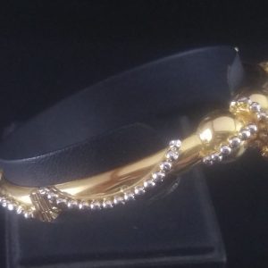 gold bracelet with silver ball